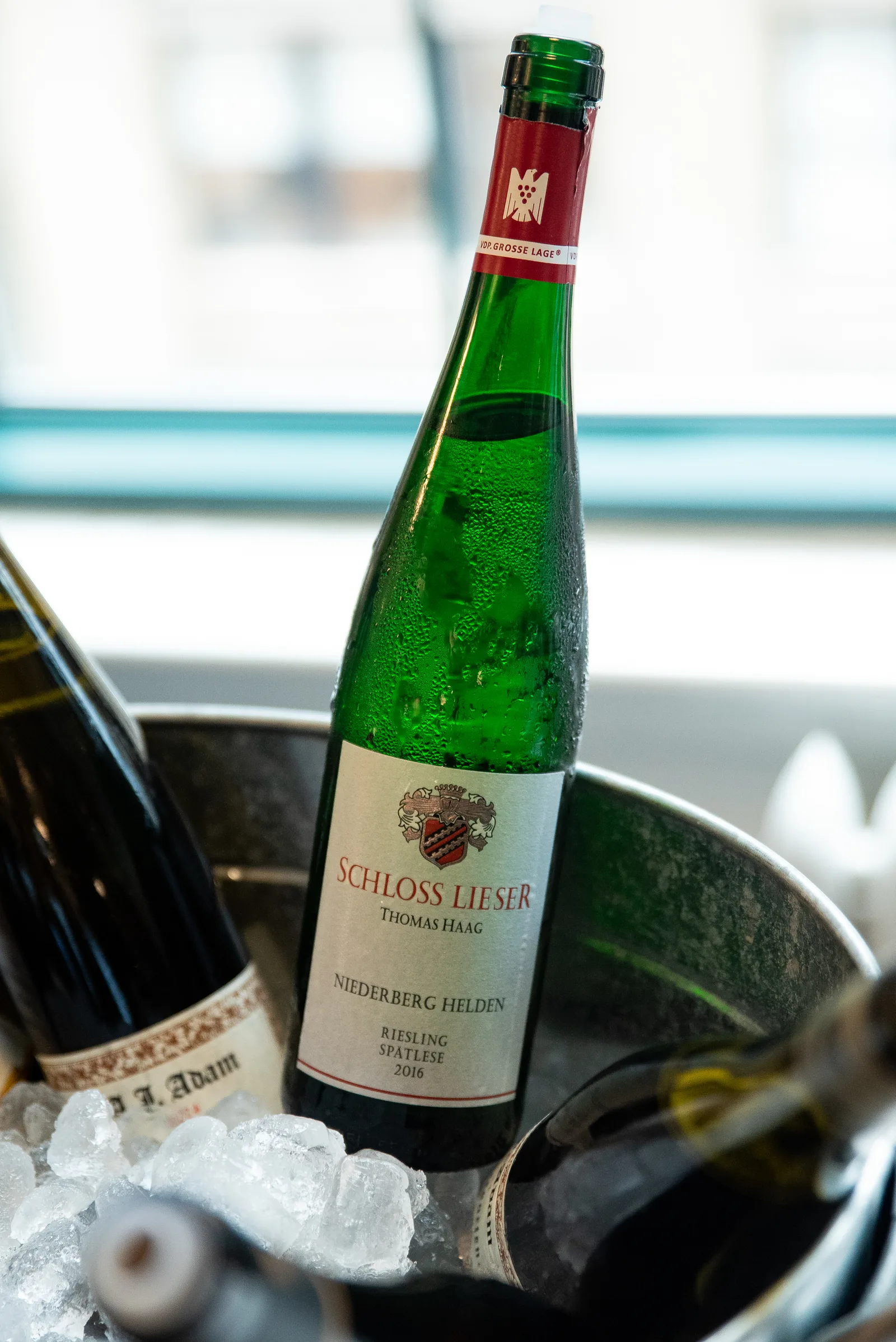 Bottle of Schloss Lieser Riesling chilled on ice